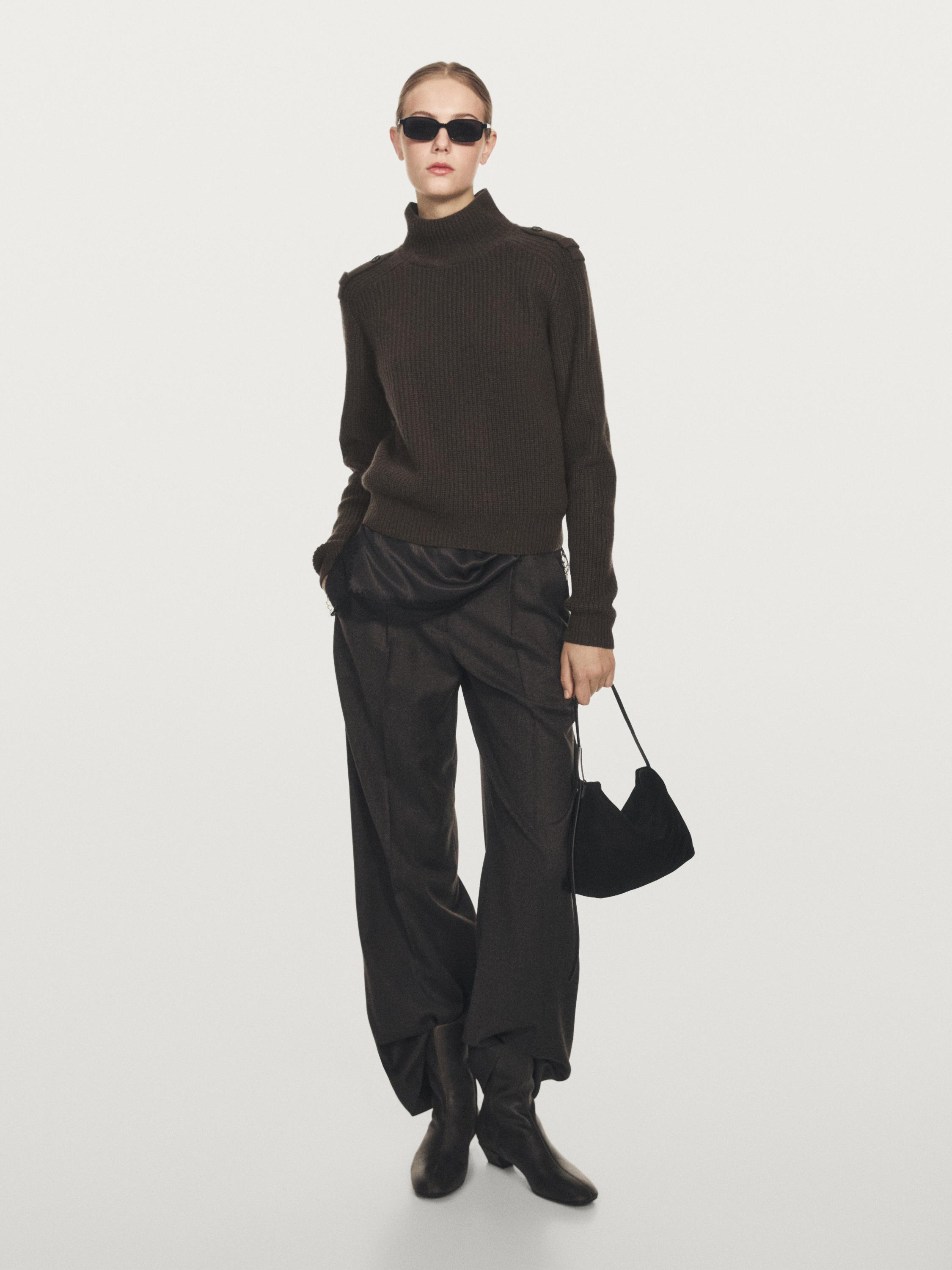 Knit sweater with shoulder detail